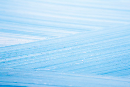 Extreme close up of blue acrylic paint texture showing brush strokes. Selective focus.の写真素材