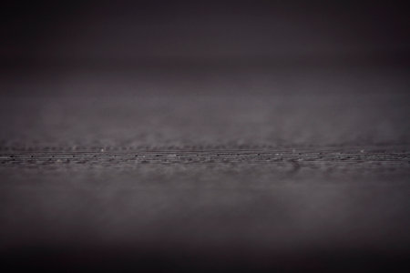 Macro shot of black vinyl record. Surface of an old vinyl record. Shallow deph of field.の写真素材