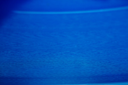 Macro shot of blue vinyl record. Surface of an old vinyl record. Shallow deph of field.の写真素材