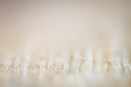 Extreme closeup of an old book from the side. Selective soft focus, shallow depth of field. Bibliophile, bookworm abstract backgroundの写真素材