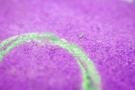 Extreme close up of purple watercolor on paper texture Selective focus. Shallow depth of field.の写真素材