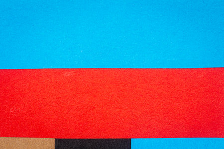 Multicolor background from a paper of different colors. Abstract colorful vibrant paper textures.の写真素材
