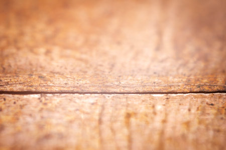 Extreme closeup of crumpled brass foil texture. Selective soft focus, shallow depth of field.