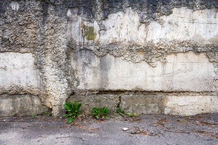 Aged weathered cracked concrete blocks wall background