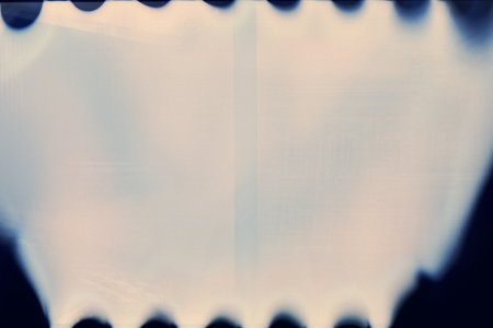 Designed film texture background with heavy grain, dust and light leakの写真素材