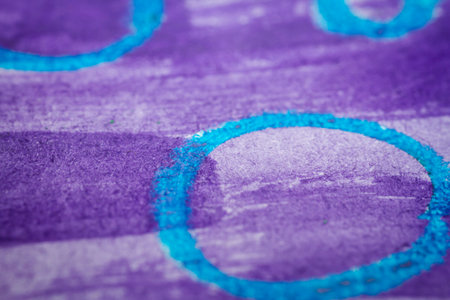 Extreme close up of purple watercolor on paper texture Selective focus. Shallow depth of field.の写真素材