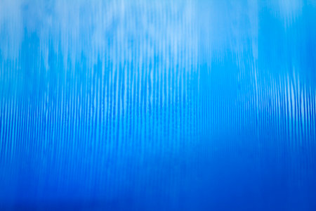 Macro shot of blue color vinyl record. Surface of an old vinyl record. Shallow deph of field.