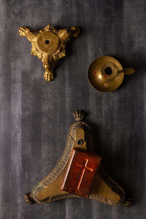 Various antique objects on black chalkboard background. Flat lay. Top view.