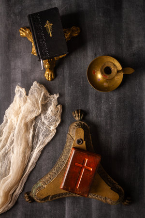 Various antique objects on black chalkboard background. Flat lay. Top view.