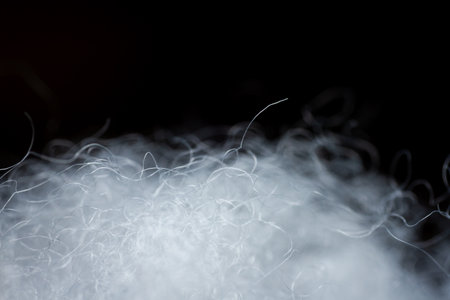 Extreme macro of polyester stable fiber. Selective focus, shallow depth of field.