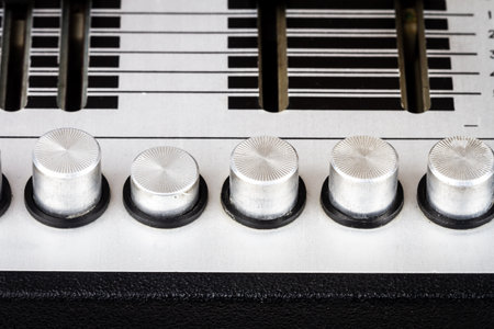 Close up of tone controls on vintage turntable vinyl record player