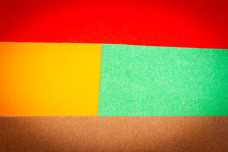 Multicolor background from a paper of different colors. Abstract colorful vibrant paper textures.の写真素材