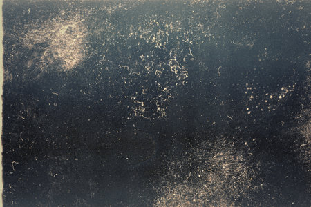 Abstract toned film texture background with grain, dust and light leakの写真素材