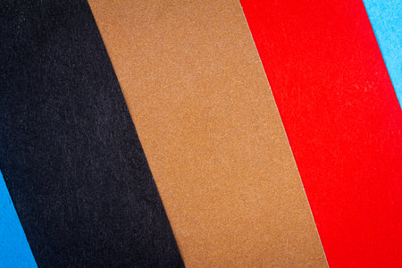 Multicolor background from a paper of different colors. Abstract colorful vibrant paper textures.の写真素材