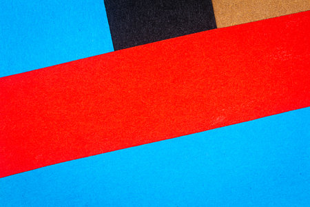 Multicolor background from a paper of different colors. Abstract colorful vibrant paper textures.の写真素材