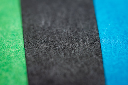 Extreme macro of multicolor background from different colors papers. Abstract colorful vibrant paper textures. Selective focus, shallow depth of field.の写真素材