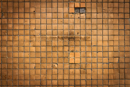 Texture of the old tile wall. Square brown small tiles on concrete texture