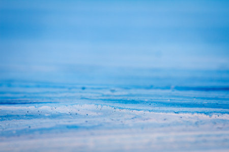 Extreme close up of blue acrylic paint texture showing brush strokes. Selective focus.の写真素材