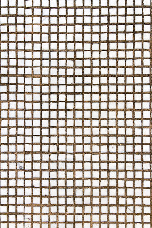 Texture of the old tile wall. Square white small tiles on concrete texture