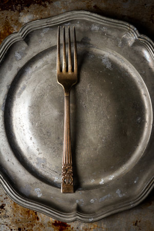 Kitchen utensils on dirty oven baking tray at kitchen, aluminum old baking sheet, top view. Grunge Background.の写真素材