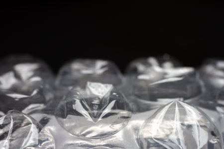 Extreme macro of plastic bubble wrap texture. Selective soft focus, shallow depth of field. Abstract dreamy backgroundの写真素材