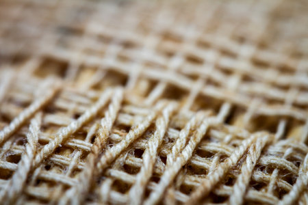 Extreme closeup of an old book from the side. Selective soft focus, shallow depth of field. Abstract background. Book binding detail.の写真素材