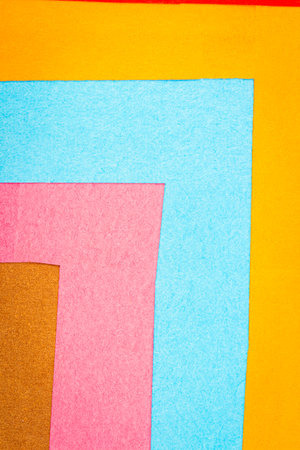 Multi color background from a paper of different colors. Abstract colorful vibrant paper textures.の写真素材