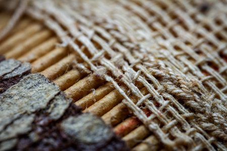 Extreme closeup of an old book from the side. Selective soft focus, shallow depth of field. Abstract background. Book binding detail.の写真素材