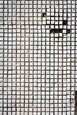 Texture of the old tile wall. Square white small tiles on concrete textureの写真素材