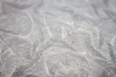 Extreme macro of plastic bubble wrap texture. Selective soft focus, shallow depth of field. Abstract dreamy backgroundの写真素材