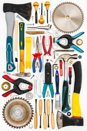 Flat lay of new and used hand tools on white background. Large collection of various tools and bits arranged on white.の写真素材