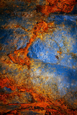 Rusty metal surface with shabby background paint. Blue cracked paint texture on an iron sheet. Fragment of an old metal door, Metal corrosion.の写真素材