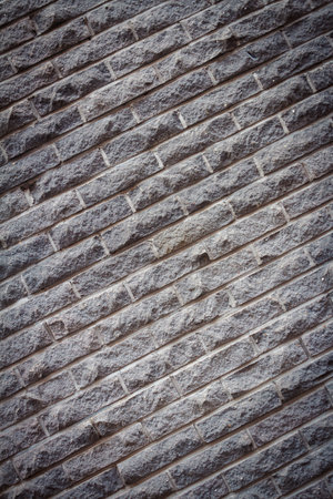 Background of old gray distressed brick wall texture, abstract architecture wallpaper.の写真素材