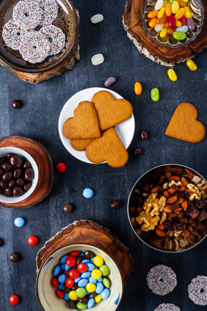 Various sweet food on black chalkboard background. Flat lay. Top view. Food concept.の写真素材
