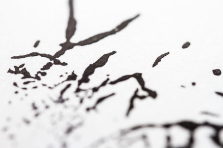 Extreme close up of black acrylic paint texture on paper. Selective focus.の写真素材