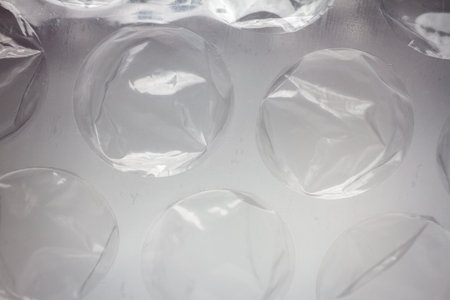 Extreme macro of plastic bubble wrap texture. Selective soft focus, shallow depth of field. Abstract...