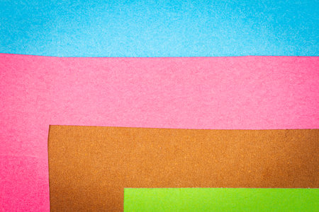 Multi color background from a paper of different colors. Abstract colorful vibrant textures paper .