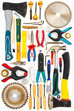 Flat lay of new and used hand tools on white background. Large collection of various tools and bits...