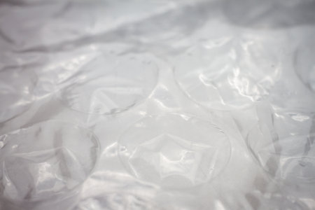 Extreme macro of plastic bubble wrap texture. Selective soft focus, shallow depth of field. Abstract...