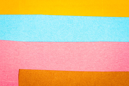 Multi color background from a paper of different colors. Abstract colorful vibrant textures paper .
