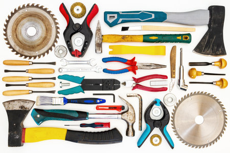 Flat lay of new and used hand tools on white background. Large collection of various tools and bits...