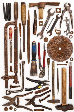 Flat lay of old hand tools on white background. Large collection of various rusty tools and bits...
