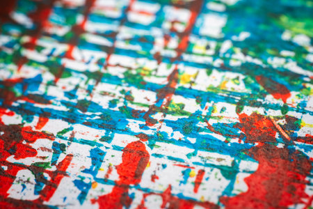 Extreme close up of colorful acrylic paint texture showing brush strokes. Selective focus.