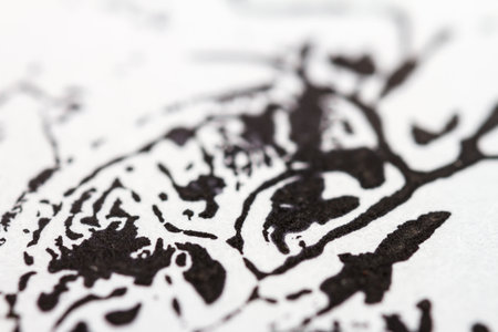 Extreme close up of black acrylic paint texture on paper. Selective focus.の写真素材