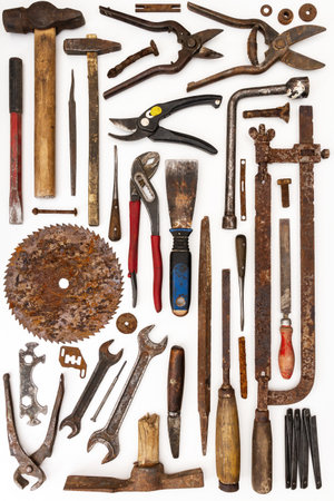 Flat lay of old hand tools on white background. Large collection of various rusty tools and bits...