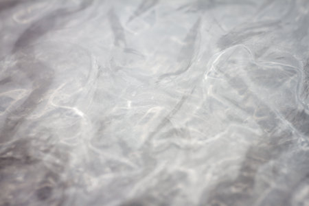 Extreme macro of plastic bubble wrap texture. Selective soft focus, shallow depth of field. Abstract dreamy backgroundの写真素材