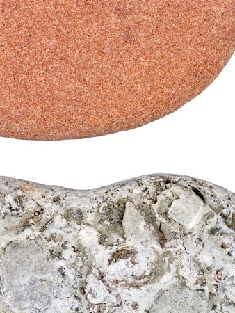 Edges of two pebbles isolated on white background with a space for textの写真素材