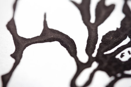 Extreme close up of black acrylic paint texture on paper. Selective focus.の写真素材