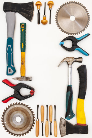 Flat lay of new and used hand tools on white background. Large collection of various tools and bits...