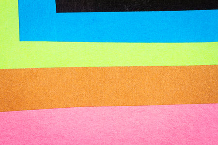 Multi color background from a paper of different colors. Abstract colorful vibrant textures paper.